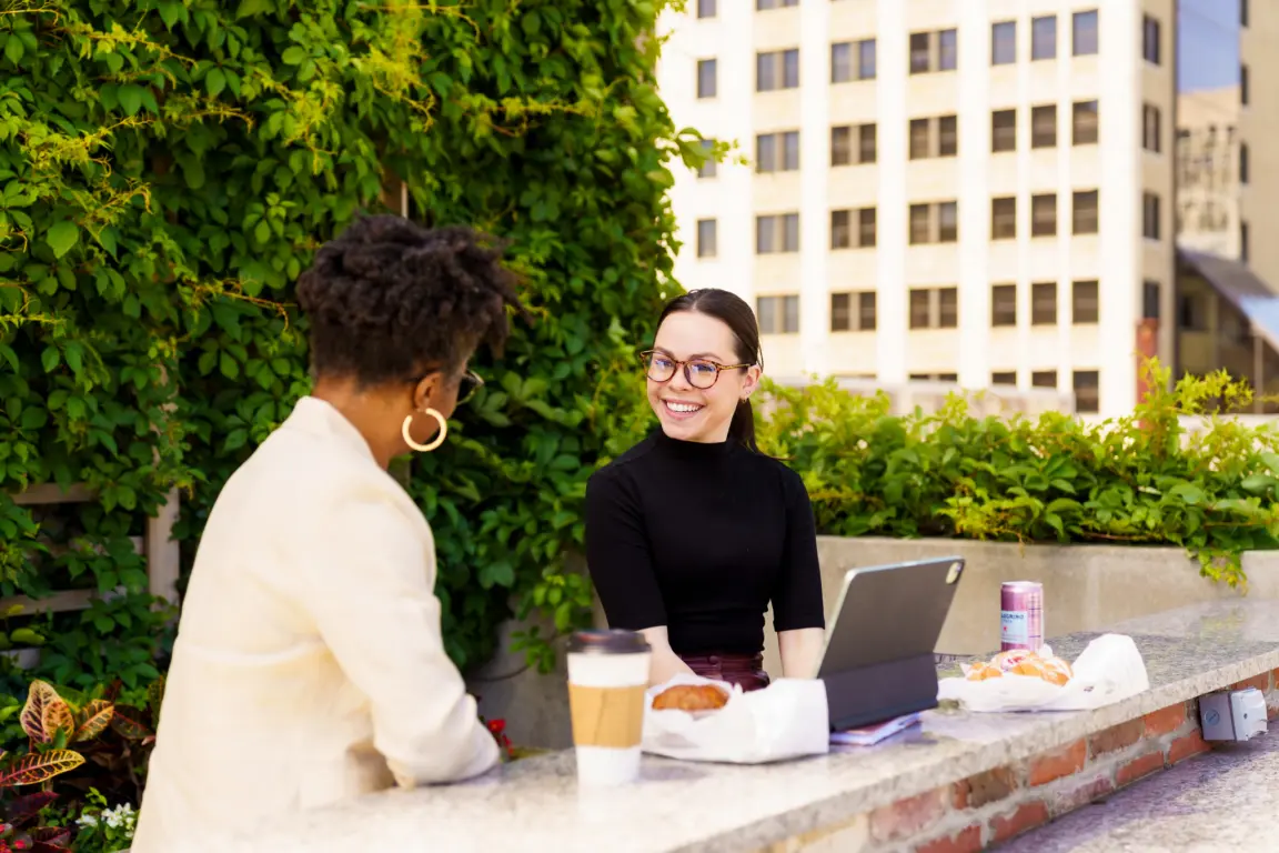 Two young professionals networking in Jacksonville, a top city for career opportunities.