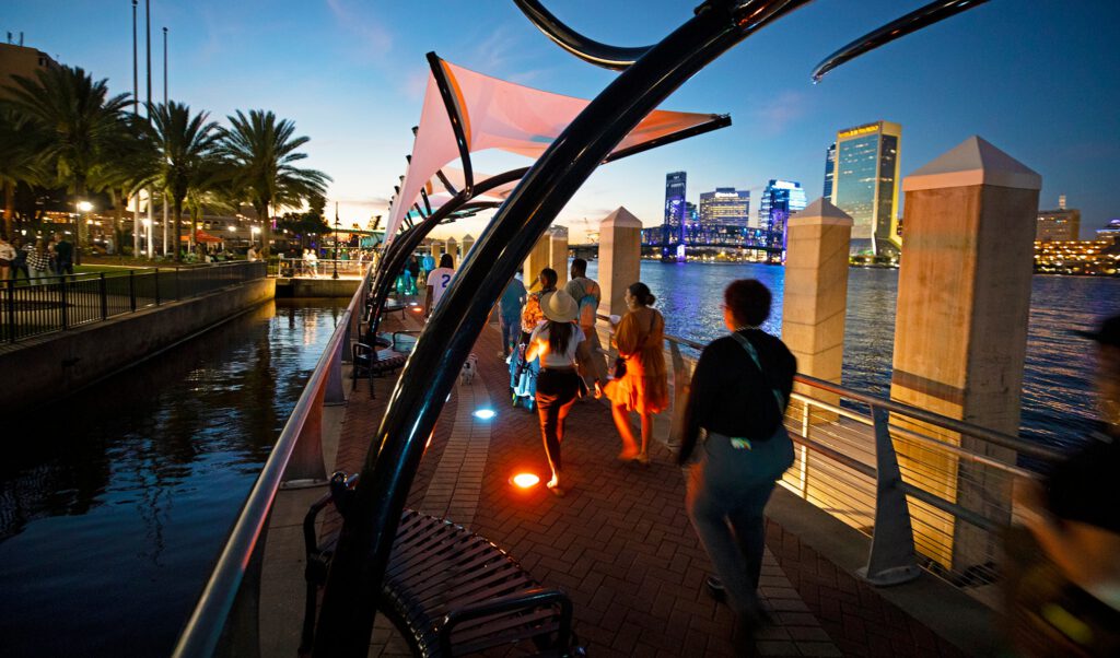 A Jacksonville pedestrian bridge is bustling with nightlife.