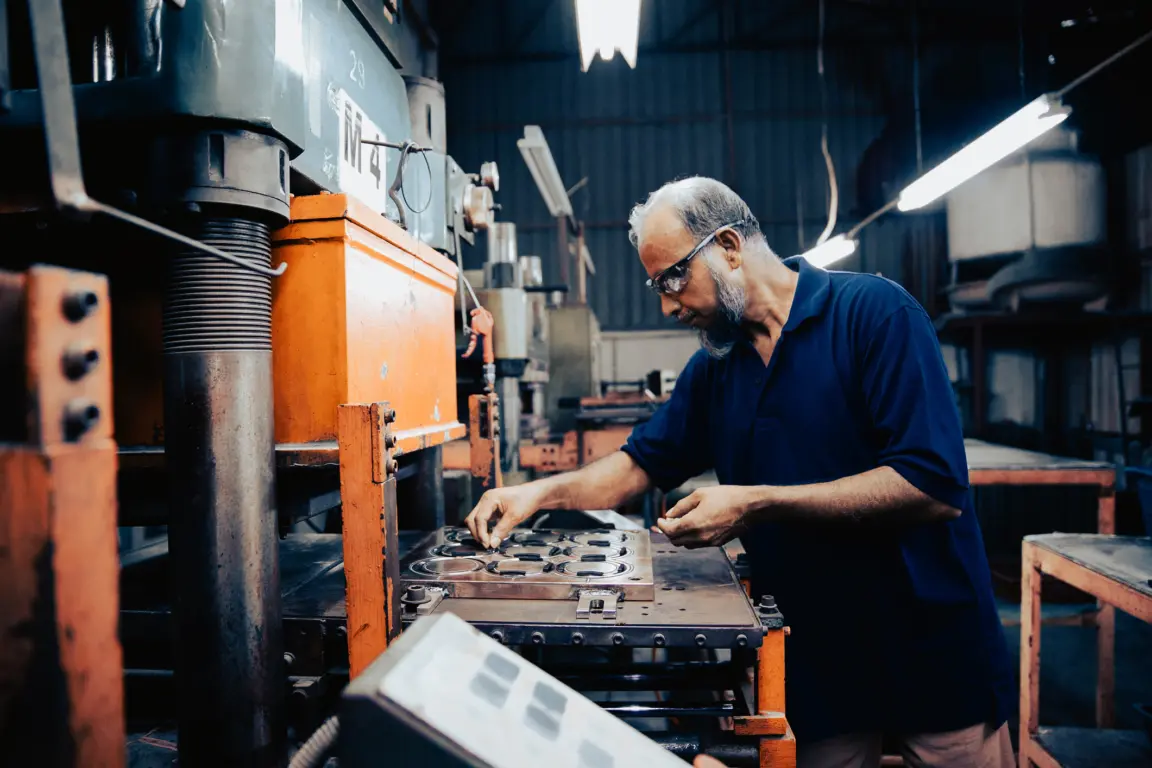 Industrial machinery operator focused on completing routine tasks